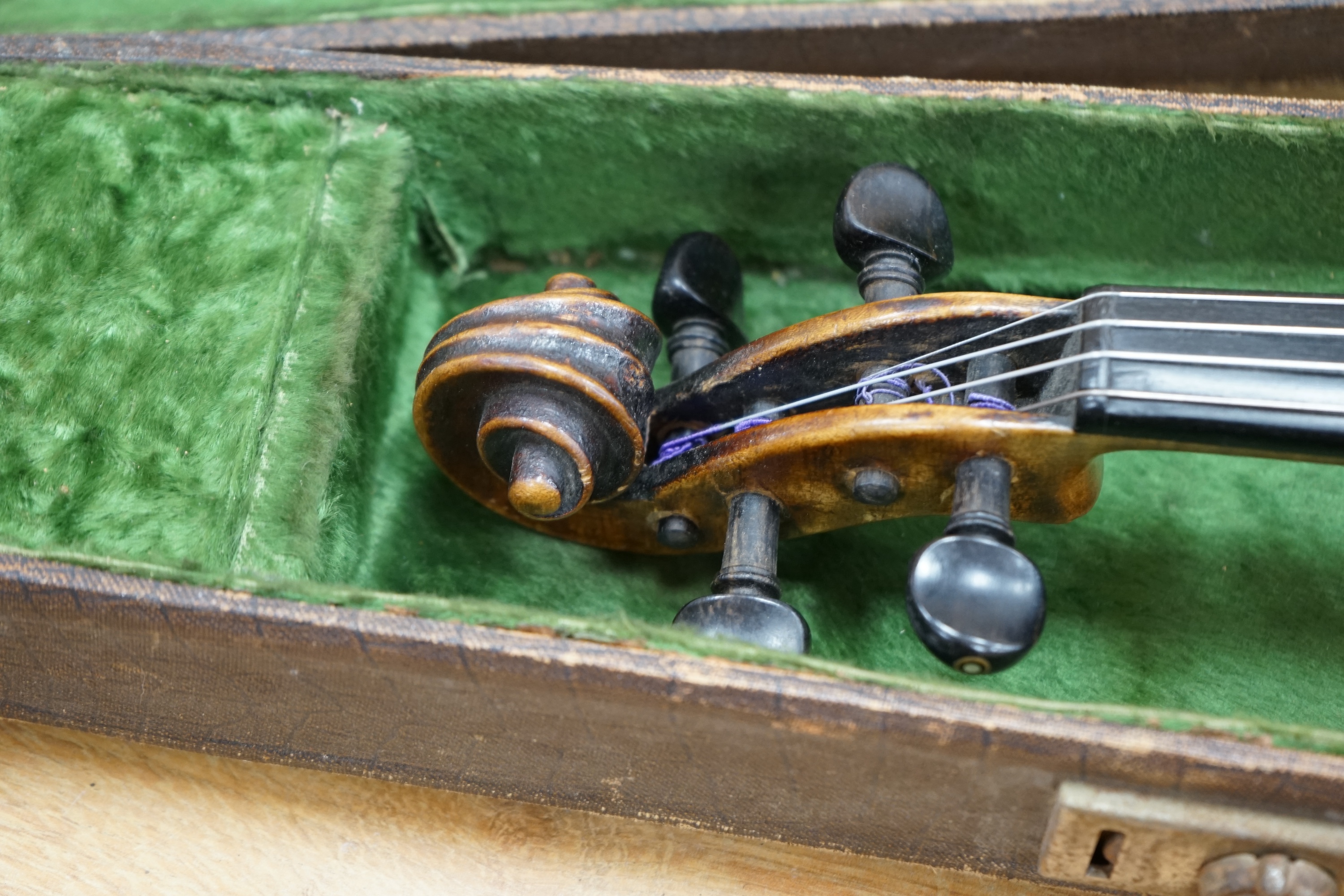 A cased 19th century English violin, with label reading George Craske, Fecit 1842, Edward Crompton, 54, Barton Arcade, Deansgate, Manchester, body length 36cm. Condition - fair to good.